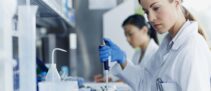 Female scientists working in modern biotechnology laboratory